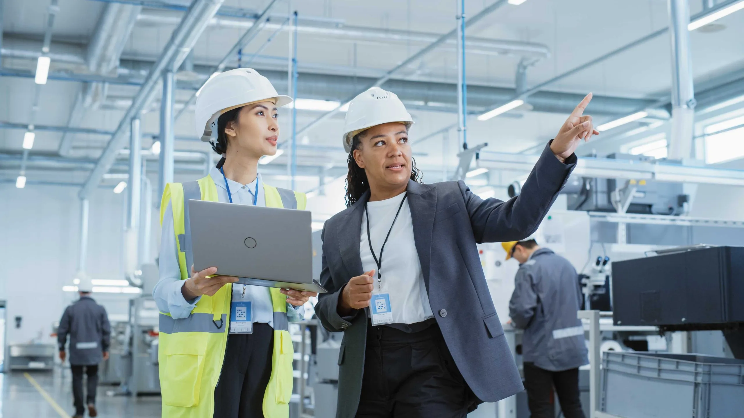 A facility manager reviewing building performance data on screen